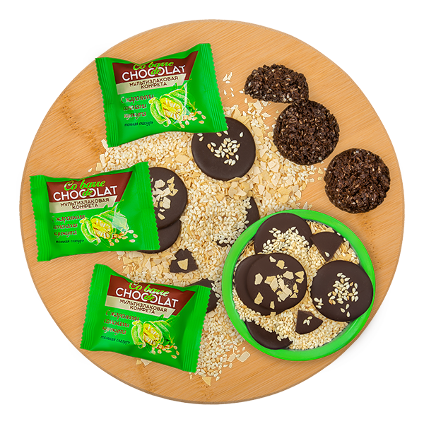 Multi-grain candies with roasted sesame seeds with dark confectionery coating