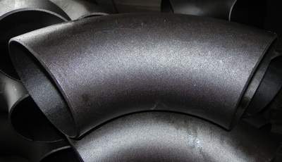 Steeply curved steel elbow